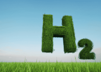 Letra H y símbolo H2 en un campo verde con cielo azul.