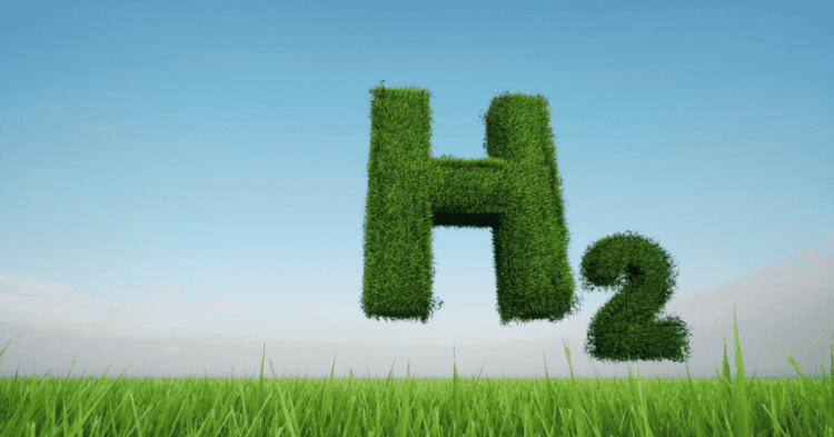 Letra H y símbolo H2 en un campo verde con cielo azul.